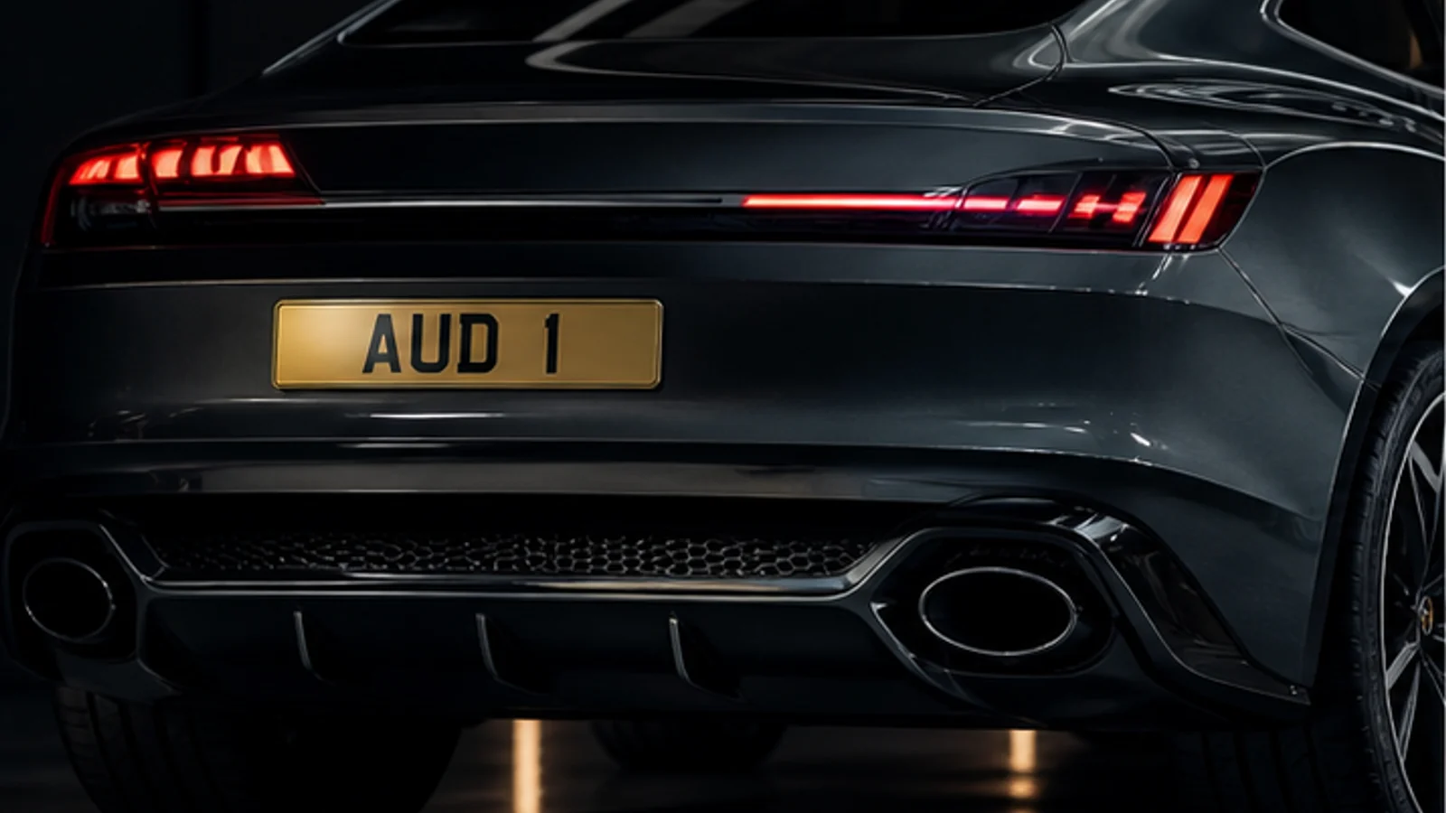 Premium Audi with AUD 1 number plate in a studio garage